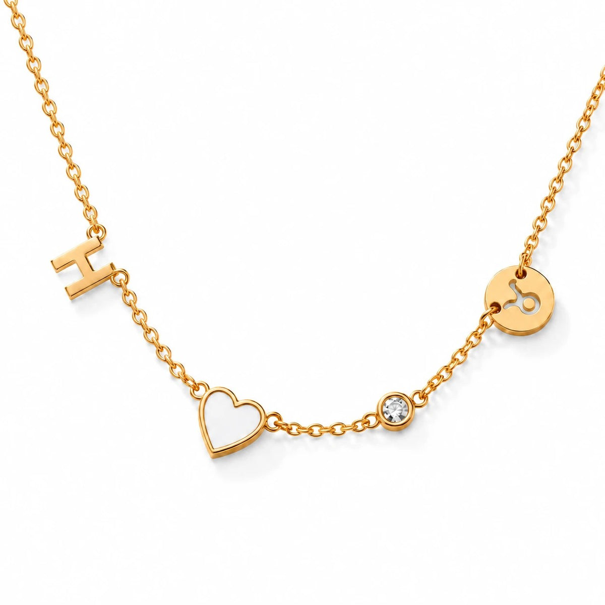 Gold necklace with H, white heart, crystal and Taurus